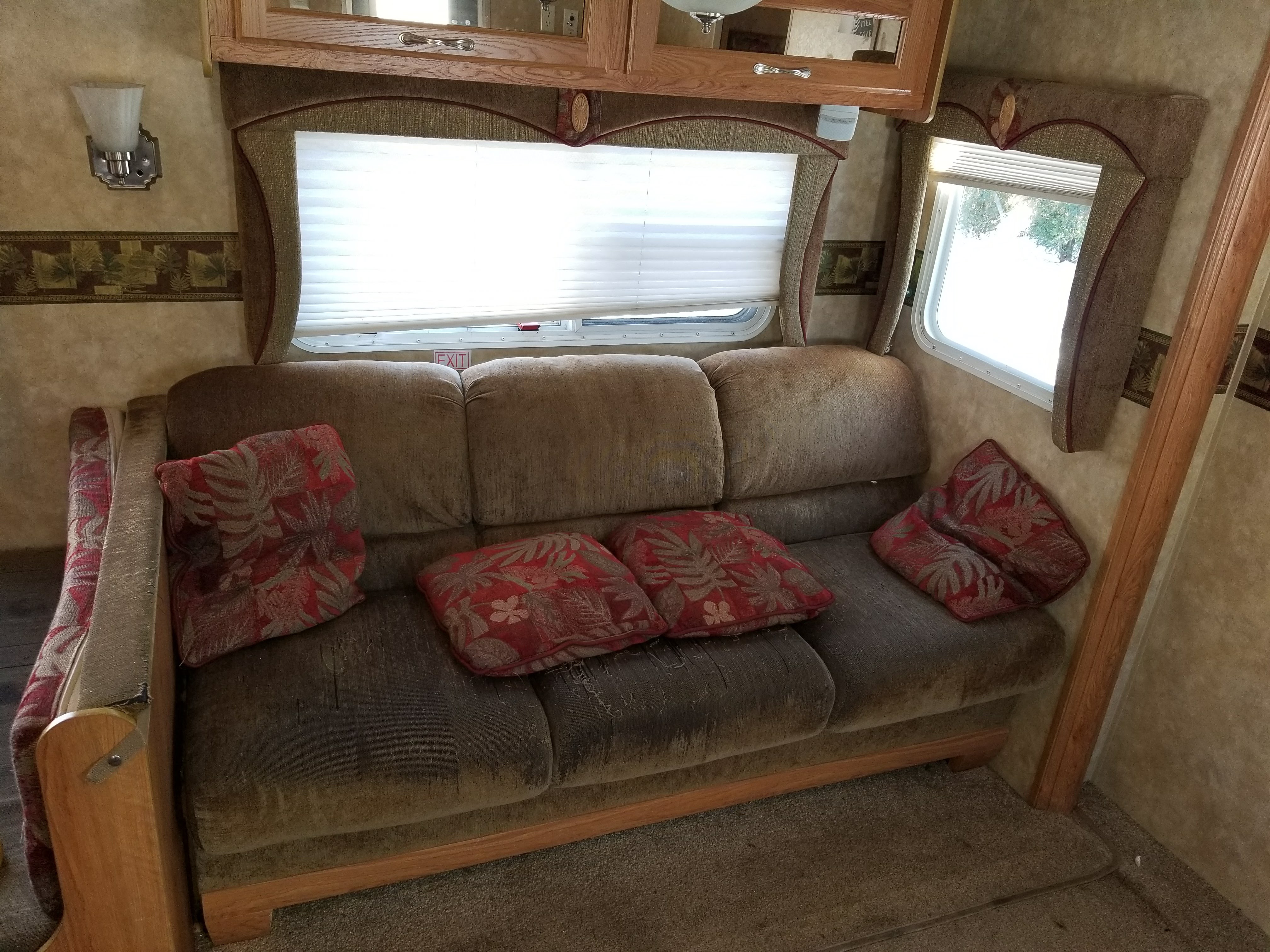 Worn RV sofa before repair